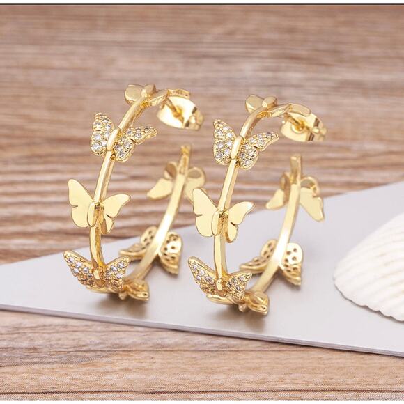 Trendy 1 1/4" pierced gold solid and clear stone butterfly hoop earrings - Picture 1 of 4